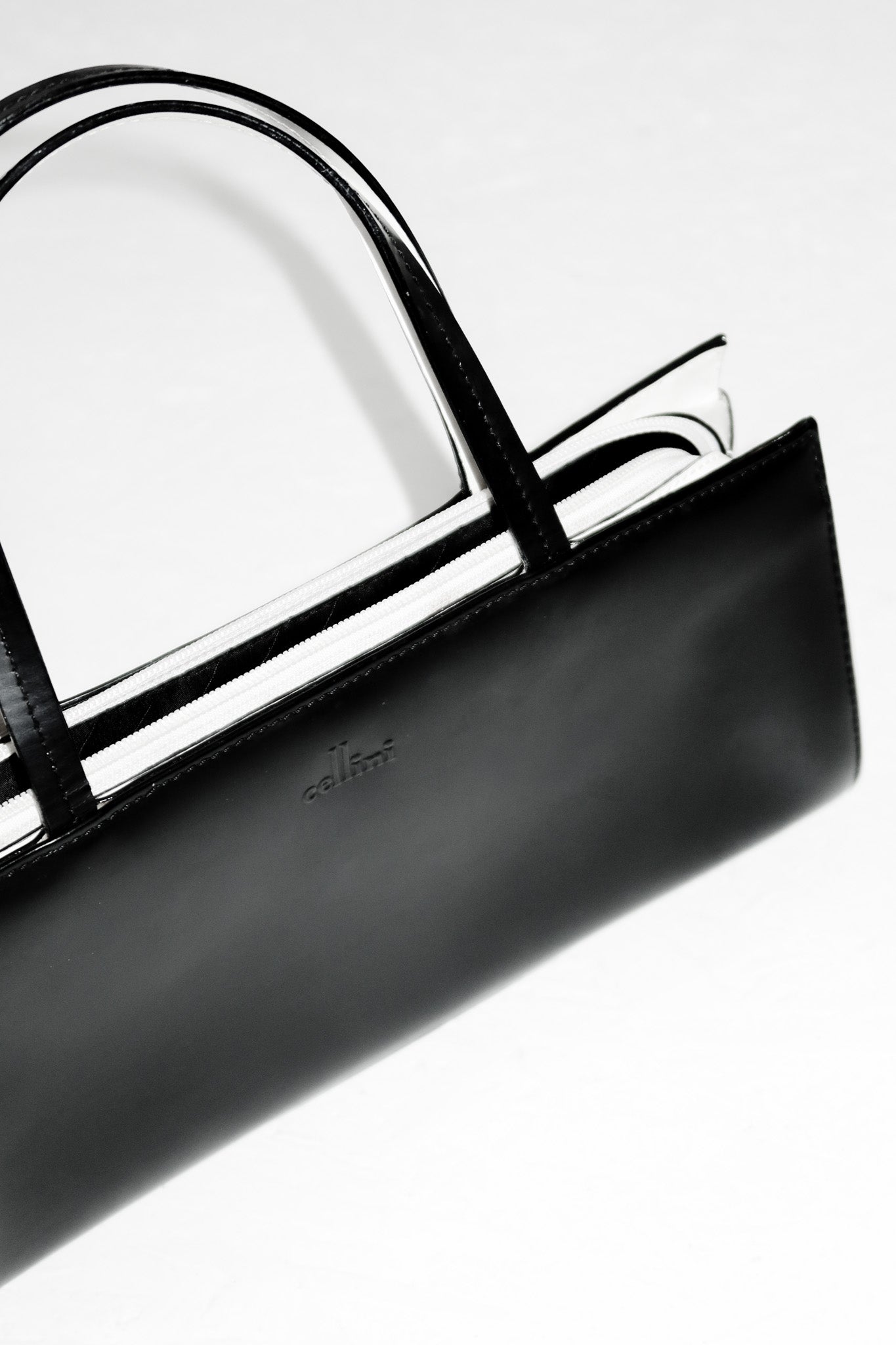 cellini leather top handle bag black/cream.