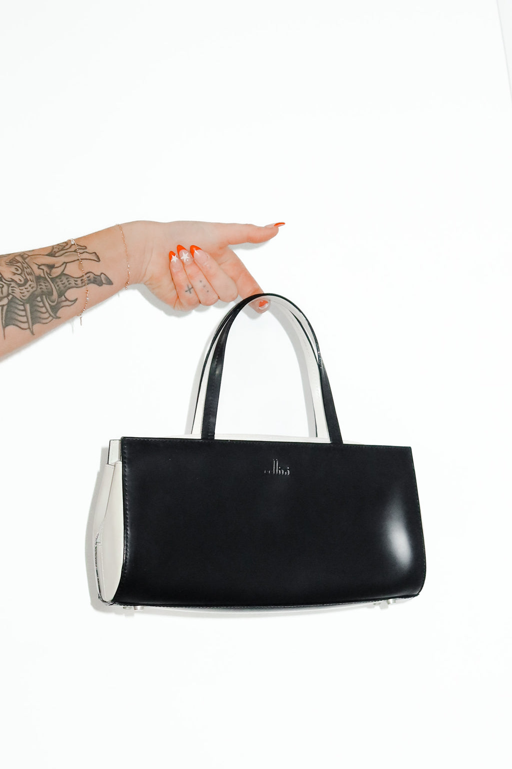 cellini leather top handle bag black/cream.