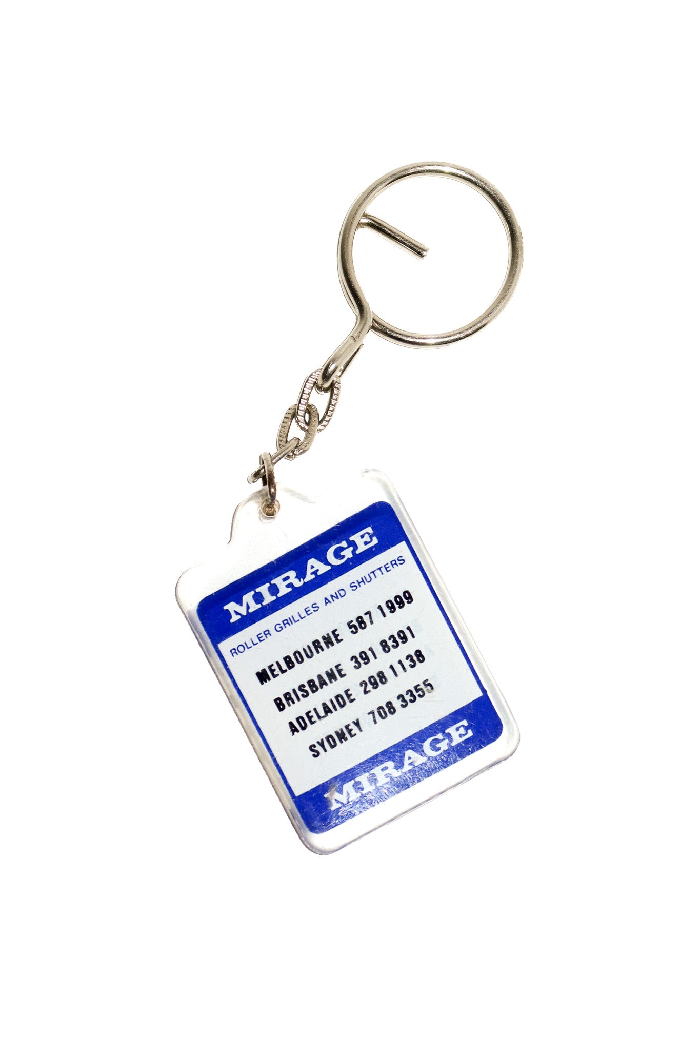 1990’s mirage roller grilles & shutters advertising keyring blue/ white.