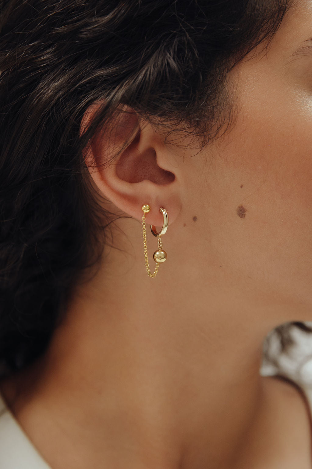 orbit earring gold.